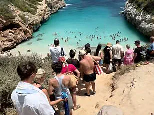 German Millionaires Plan to Seal Off Overcrowded Caló des Moro Beach Amid Environmental Toll