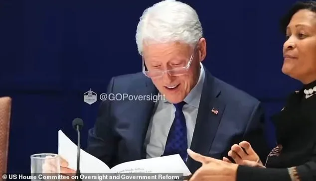 Bill Clinton examines hot tub photo from Epstein files during deposition