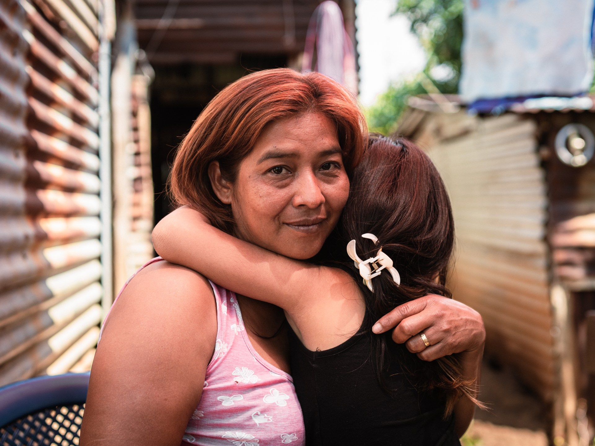 Inheritance of Faith: A Salvadoran Girl's Medallion Amidst a Father's Imprisonment