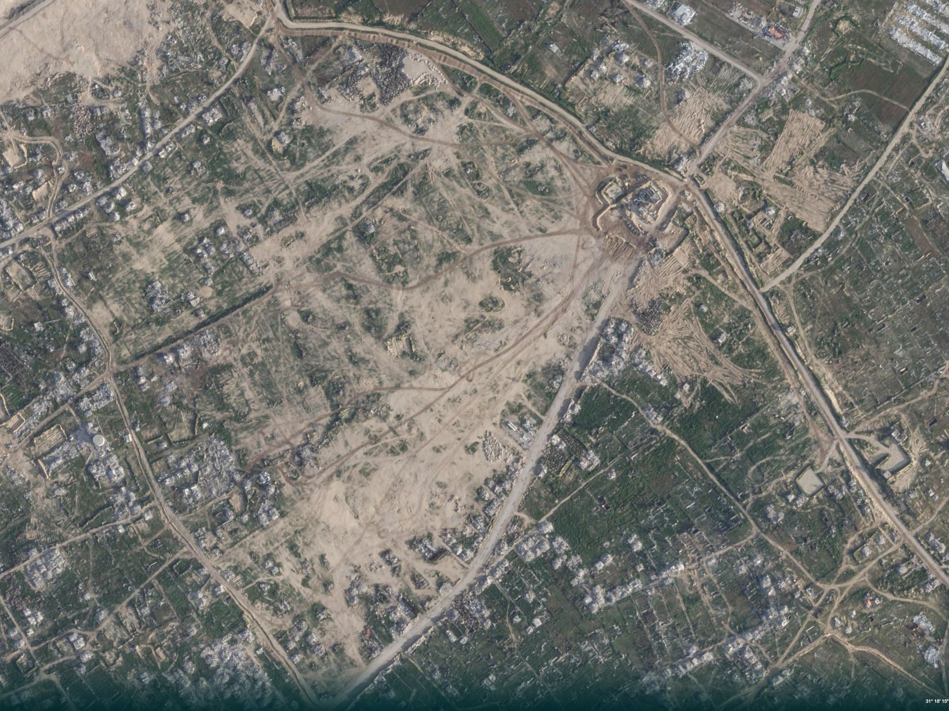Satellite images reveal Israel expands military sites in Gaza while US reconstruction stalls.