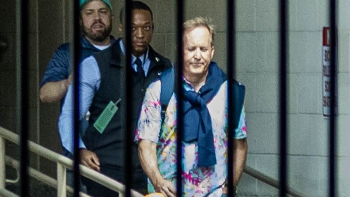 Ken Paxton confidently exits hotel in Hawaiian shirt hours before primary win.