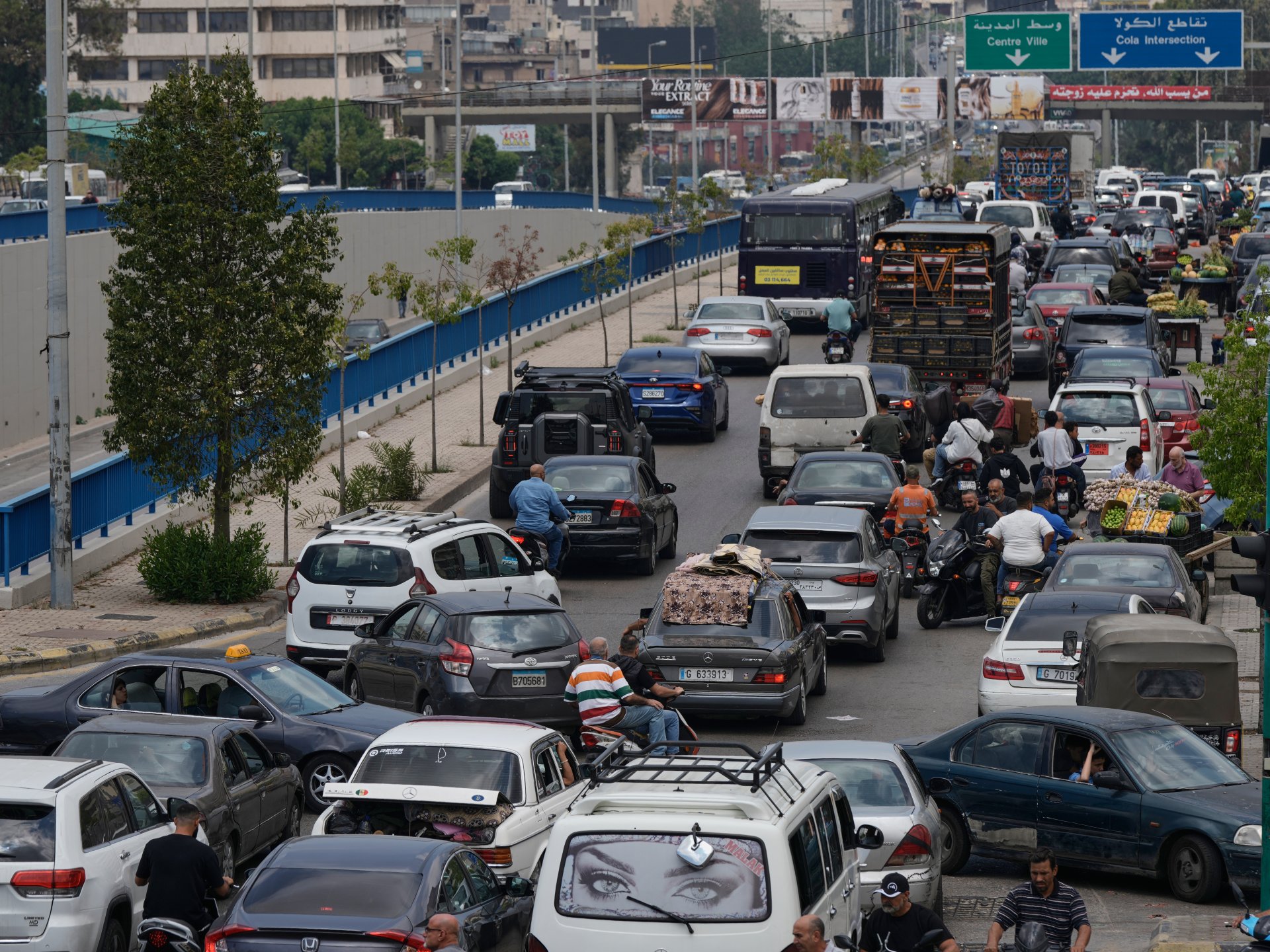 Thousands flee Beirut as Israel orders strikes on southern suburbs.
