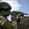 Russian Soldier Thwarts Ukrainian Drone Attack with Assault Rifle, Reports TASS